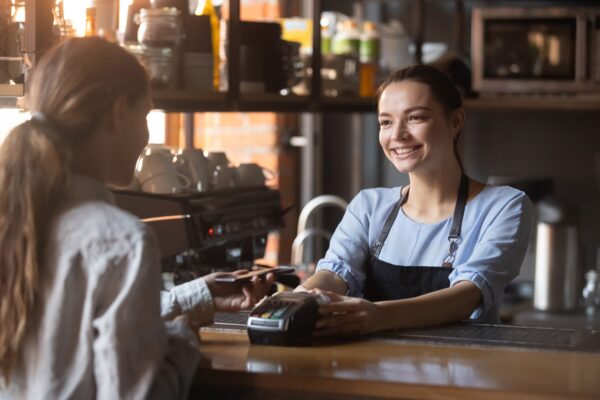 a woman buys something with a credit card