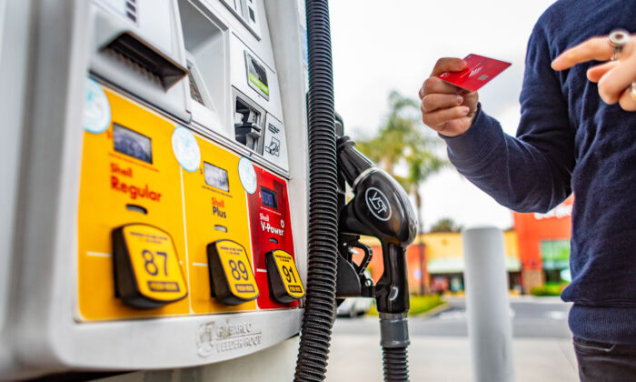 A man pumps gas in Irvine, Calif., on April 1, 2022. (John Fredricks/The Epoch Times)