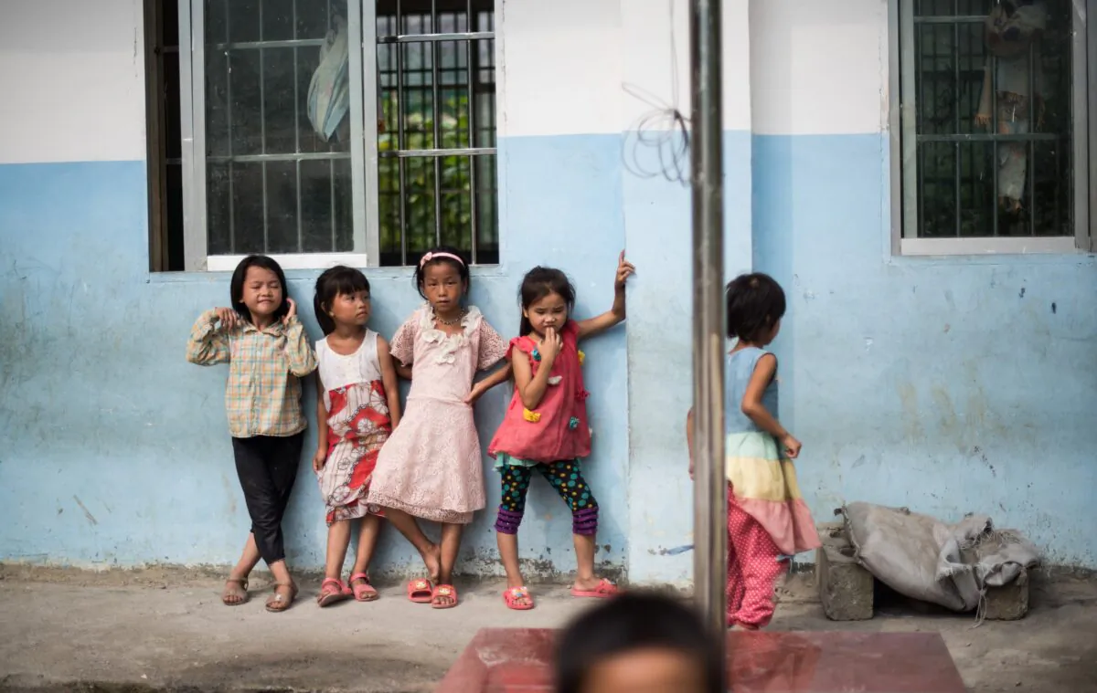 Children playing in the schoolyard of the Chongshan Primary School in the town of Longfu Township, in Guangxi. (Johannes Eisele /AFP via Getty Images)