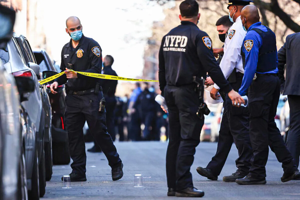 NYPD officers respond to the scene of a shooting that left multiple people injured in the Flatbush neighborhood in the Brooklyn borough of New York City on April 6, 2021. Michael M. Santiago/Getty Images