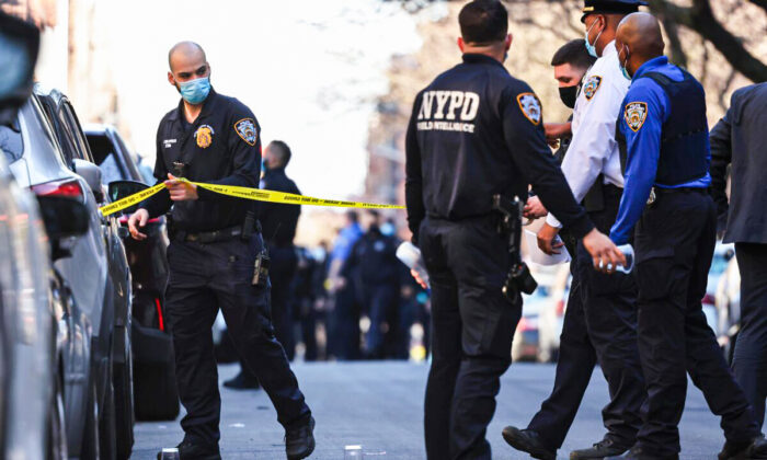 NYPD officers respond to the scene of a shooting that left multiple people injured in the Flatbush neighborhood in the Brooklyn borough of New York City on April 6, 2021. Michael M. Santiago/Getty Images