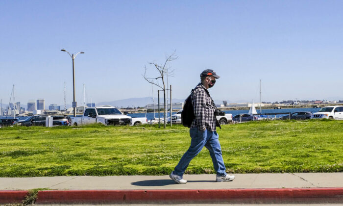 A man walks in San Diego, Calif., on March 27, 2021. (John Fredricks/The Epoch Times)