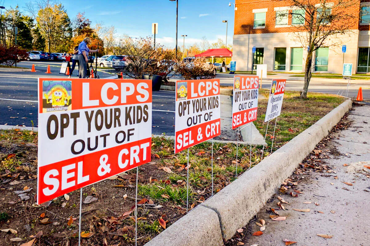 Signs against critical race theory in front of the Loudoun County School Administration building in Virginia on Nov. 9, 2021. (Terri Wu/The Epoch Times)