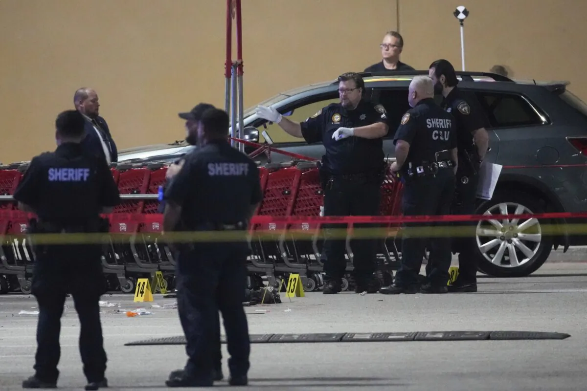 Law enforcement officers investigate the scene of shooting in Houston, on March 31, 2022. (Brett Coomer/Houston Chronicle via AP)