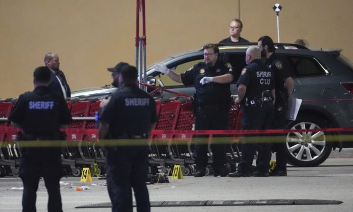 Law enforcement officers investigate the scene of shooting in Houston, on March 31, 2022. (Brett Coomer/Houston Chronicle via AP)