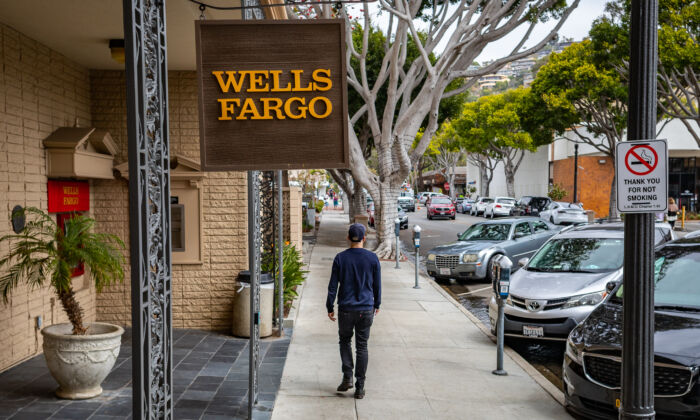 A man walks past a Wells Fargo bank in Laguna Beach, Calif., on April 1, 2022. The bank expects the United States to enter recession in 2023. (John Fredricks/The Epoch Times)