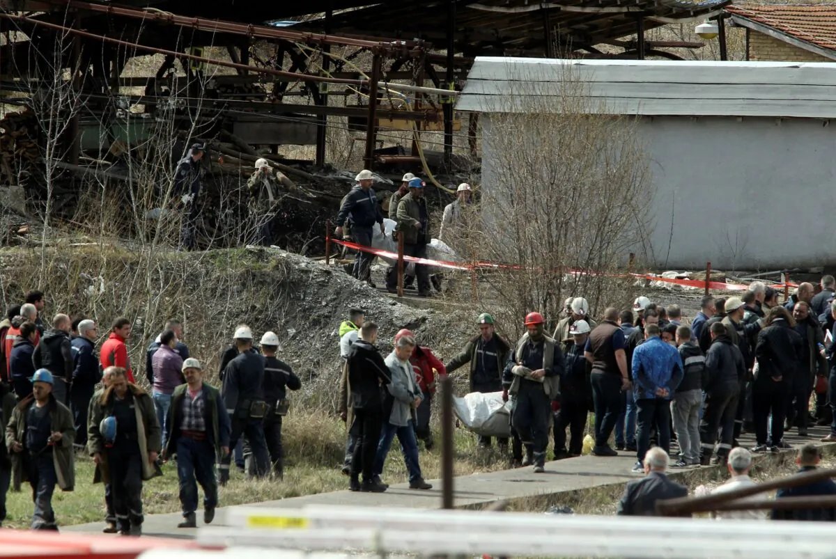 Rescue workers carry a body after a shaft collapsed in Soko coal mine, in central Serbia, on April 1, 2022. (AP Photo)