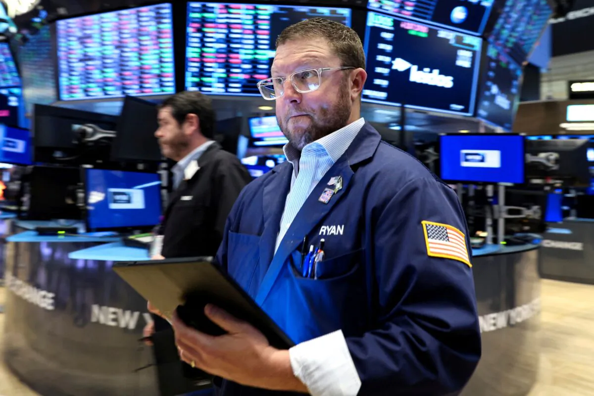 Traders work on the floor of the New York Stock Exchange in New York City, on March 30, 2022. (Brendan McDermid/Reuters)
