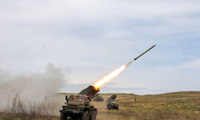 A Ukrainian multiple rocket launcher BM-21 "Grad" shells Russian troops' position, near Lugansk, in the Donbass region, on April 10, 2022. (Anatolii Stepanov/AFP via Getty Images)