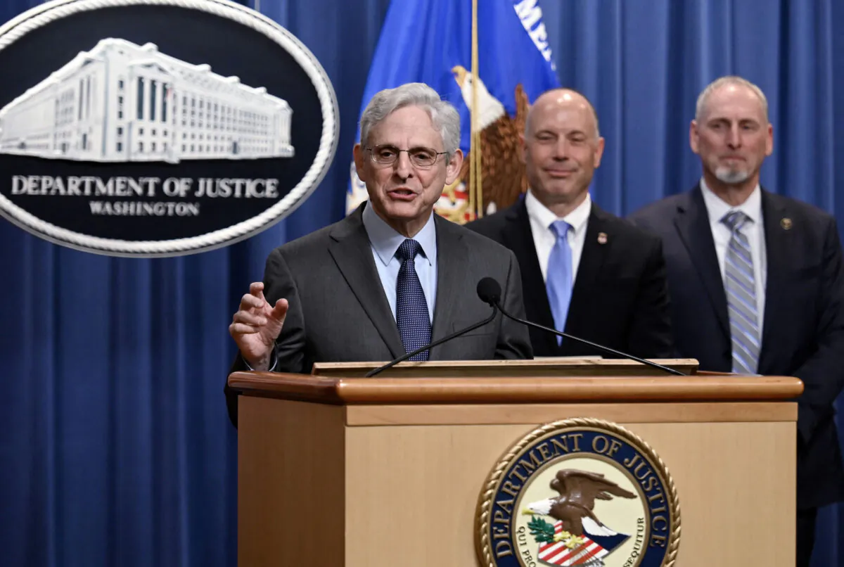 Attorney General Merrick Garland, alongside U.S. Attorney Mark Wildasin (2R), for the Middle District of Tennessee, and ATF Special Agent in Charge Mickey French of the Nashville Field Division (R), speaks about a significant firearms trafficking enforcement action during a news conference at the Justice Department in Washington, on April 1, 2022. (Olivier Douliery/AFP via Getty Images)