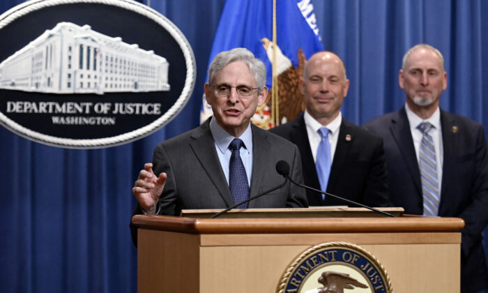 Attorney General Merrick Garland, alongside U.S. Attorney Mark Wildasin (2R), for the Middle District of Tennessee, and ATF Special Agent in Charge Mickey French of the Nashville Field Division (R), speaks about a significant firearms trafficking enforcement action during a news conference at the Justice Department in Washington, on April 1, 2022. (Olivier Douliery/AFP via Getty Images)