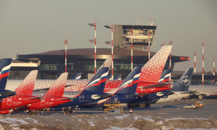 Passenger planes owned by Russia's airlines, including Aeroflot and Rossiya, are parked at Sheremetyevo International Airport in Moscow, Russia, on March 1, 2022. (Marina Lystseva/Reuters)