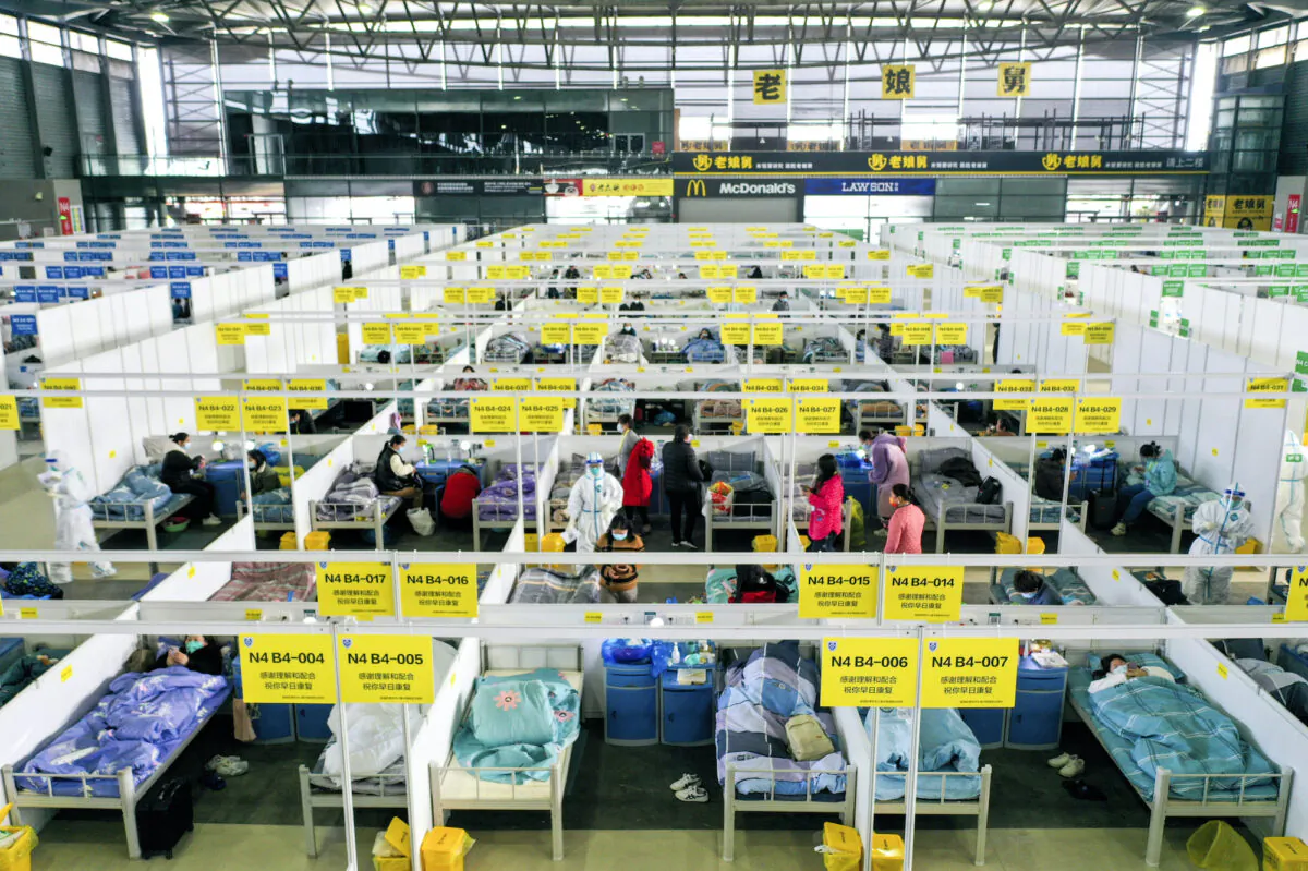 People with mild and symptomatic cases of COVID-19 quarantine at the Shanghai New International Expo Center in China on April 1, 2022. (Ding Ting/Xinhua via AP)