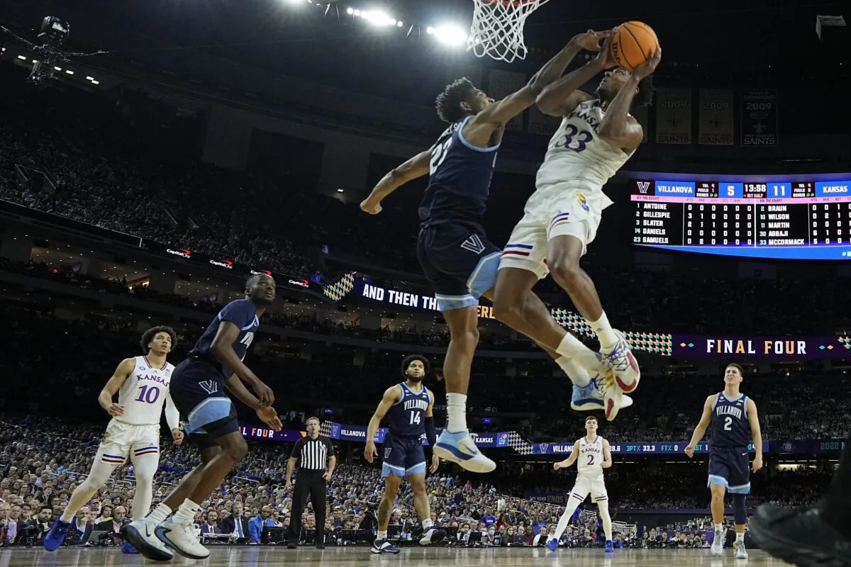 Kansas' David McCormack (33) shoots over Villanova's Jermaine Samuels (23) during the first half of a college basketball game in the semifinal round of the Men's Final Four NCAA tournament in New Orleans, on April 2, 2022. (David J. Phillip/AP Photo)