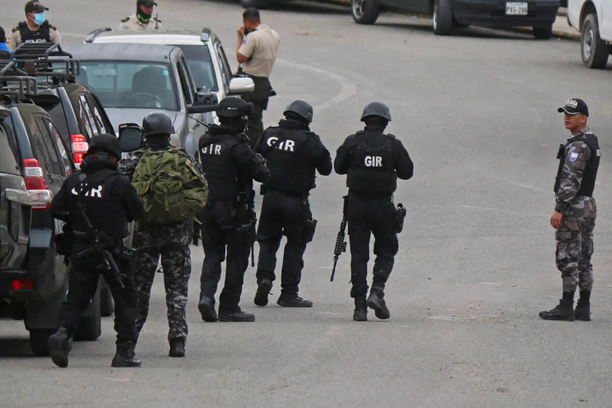 Soldiers and policemen outside the CRS Turi prison after a riot in Cuenca, Ecuador, on April 3, 2022. (Fernando Machado/AFP via Getty Images)