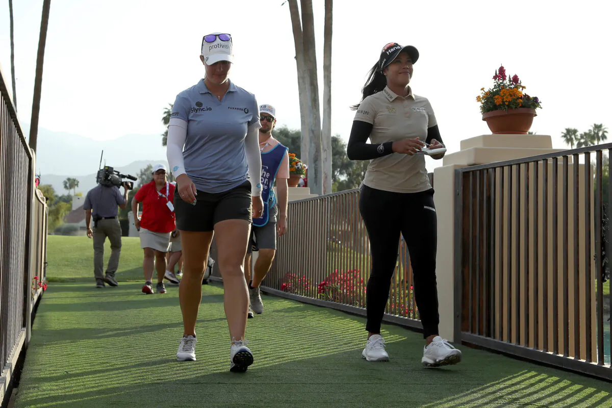 Patty Tavatanakit of Thailand and Jennifer Kupcho of the United States walk off the 18th hole following the third round of The Chevron Championship at The Westin Mission Hills Golf Resort & Spa on April 02, 2022 in Rancho Mirage, California. (Katelyn Mulcahy/Getty Images)