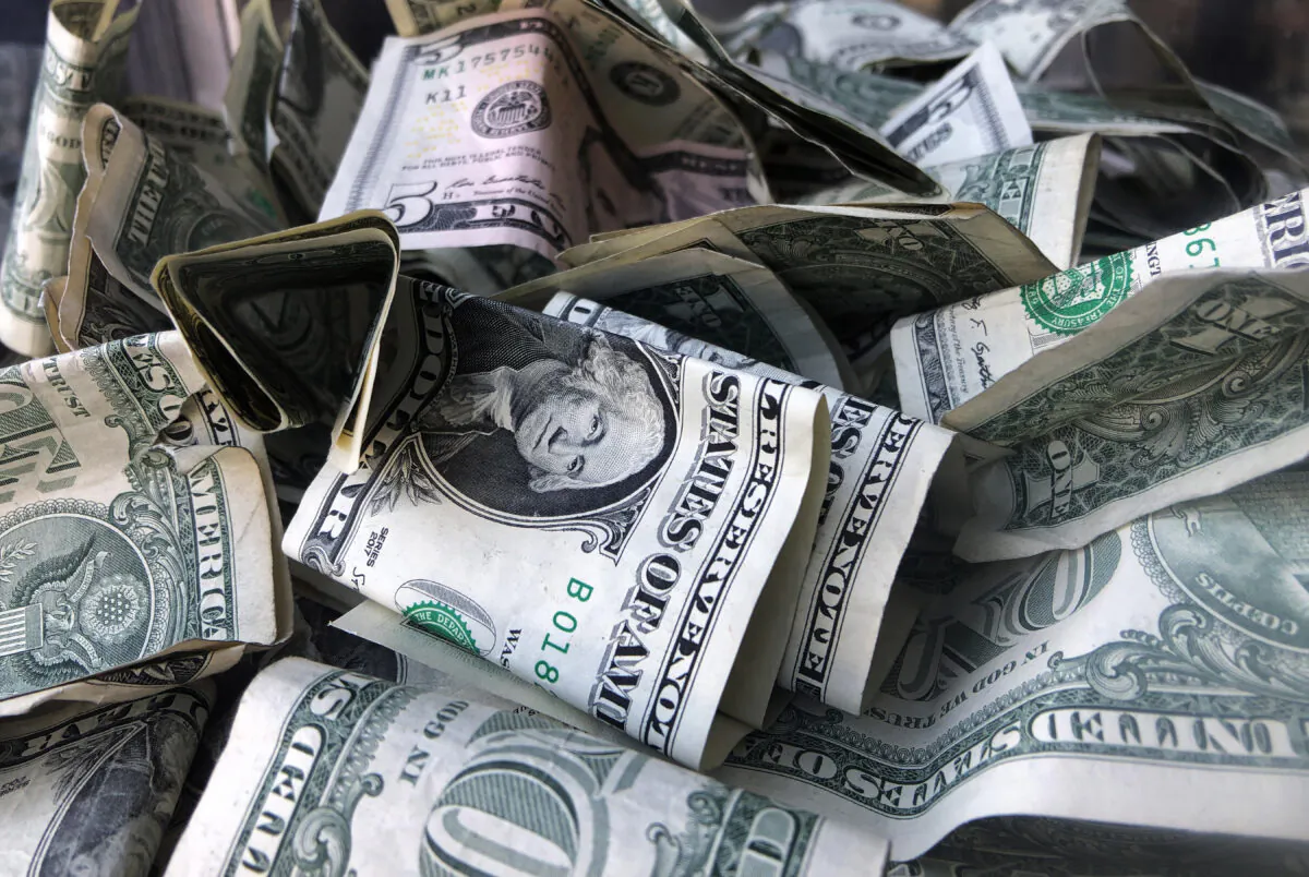 A box filled with dollar bills is shown in New York City on April 3, 2019. (Mark Lennihan/AP Photo)