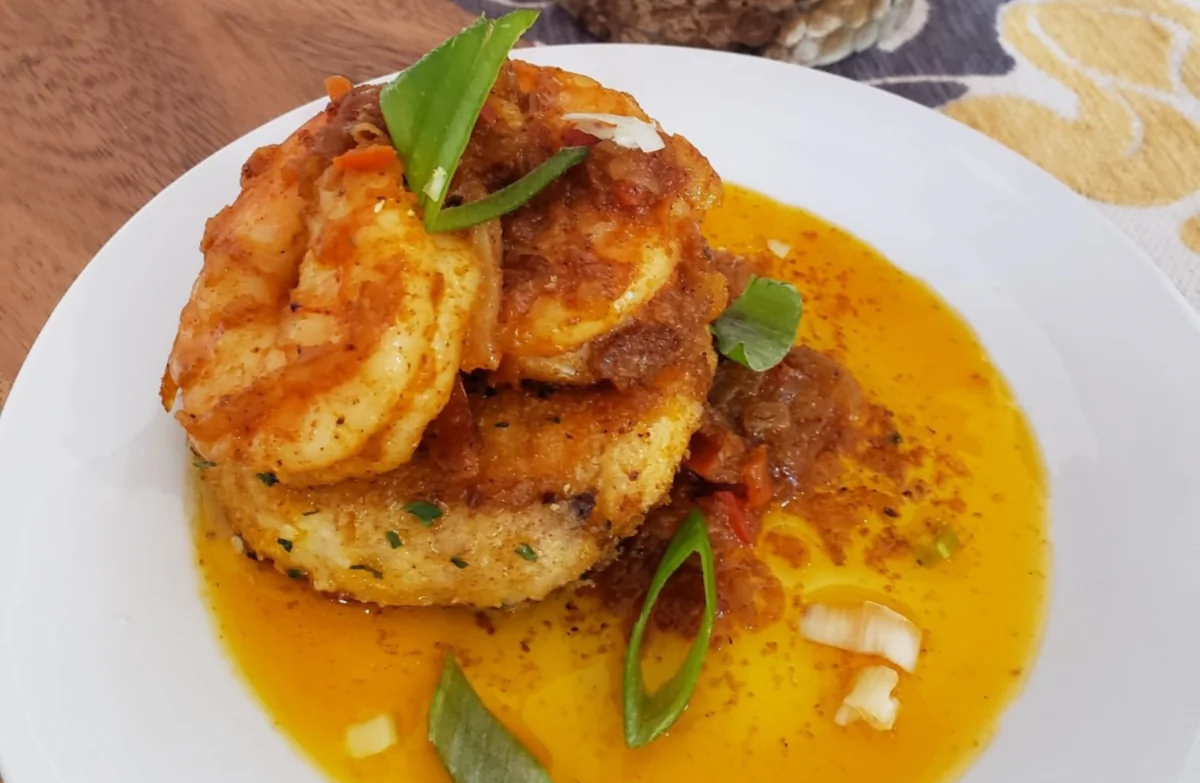 BBQ shrimp with sage sausage and smoked gouda grit cake. (Courtesy of Daniela Roebuck)