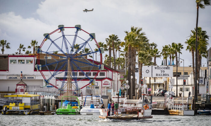 People enjoy riding the Balboa Island Ferry boats across Newport Beach harbor on Dec. 29, 2021. (John Fredricks/The EPoch Times)