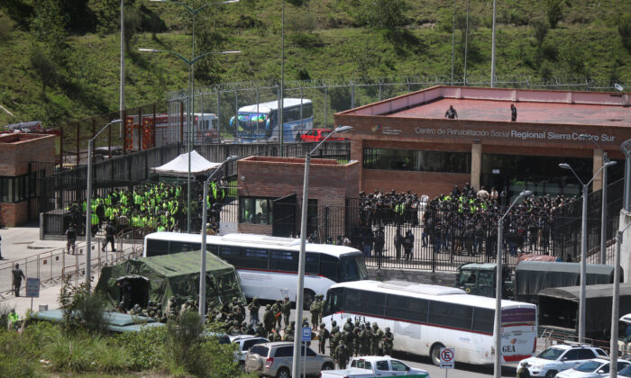 Police and military guard the CRS Turi prison a day after a riot in Cuenca, Ecuador, on April 4, 2022. (Fernando Machado/AFP via Getty Images)