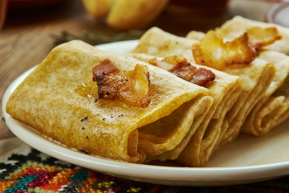 Nalysnyky are traditionally stuffed with cottage cheese and dill, but you can use whatever filling you like. (Chatham172/Shutterstock)
