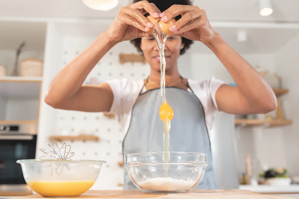 Your eggs vibrant yolk color might have less to do with how the chicken was raised, than what it was fed. (Shutterstock)