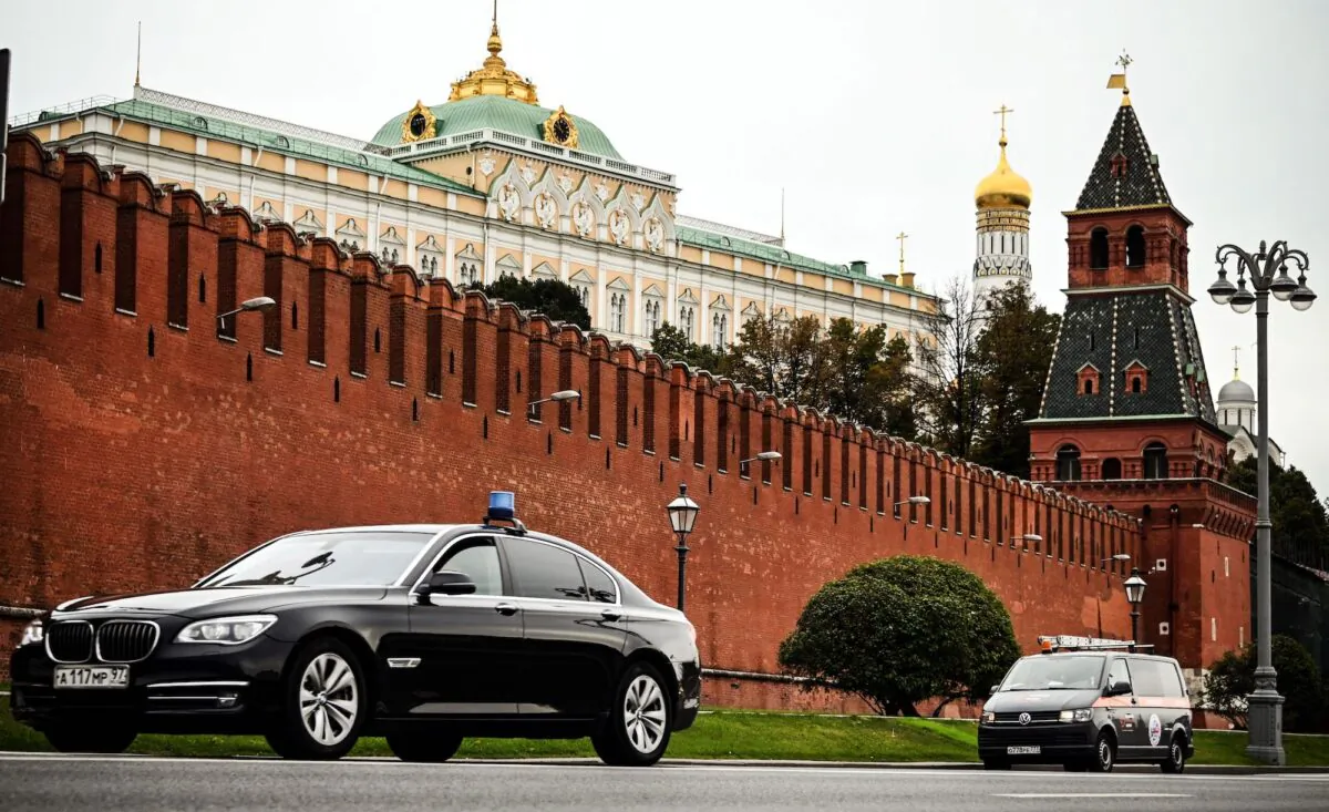 Cars drive past the Kremlin during the last day of the three-day parliamentary and local elections in Moscow, Russia, on Sept. 19, 2021. (Alexander Nemenov/AFP via Getty Images)