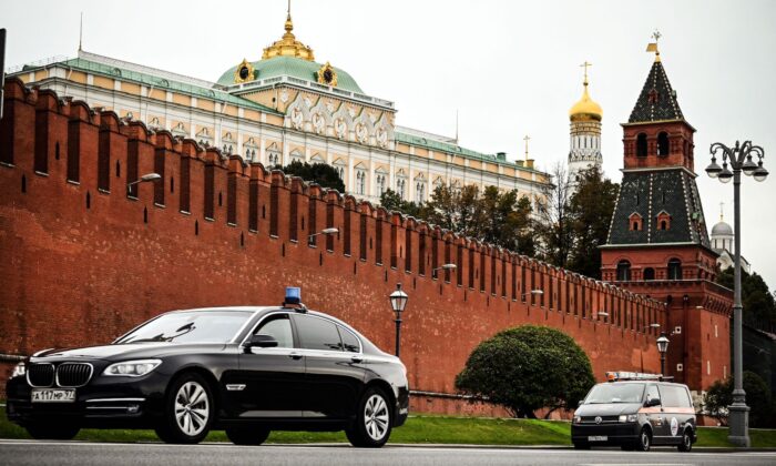 Cars drive past the Kremlin during the last day of the three-day parliamentary and local elections in Moscow, Russia, on Sept. 19, 2021. (Alexander Nemenov/AFP via Getty Images)