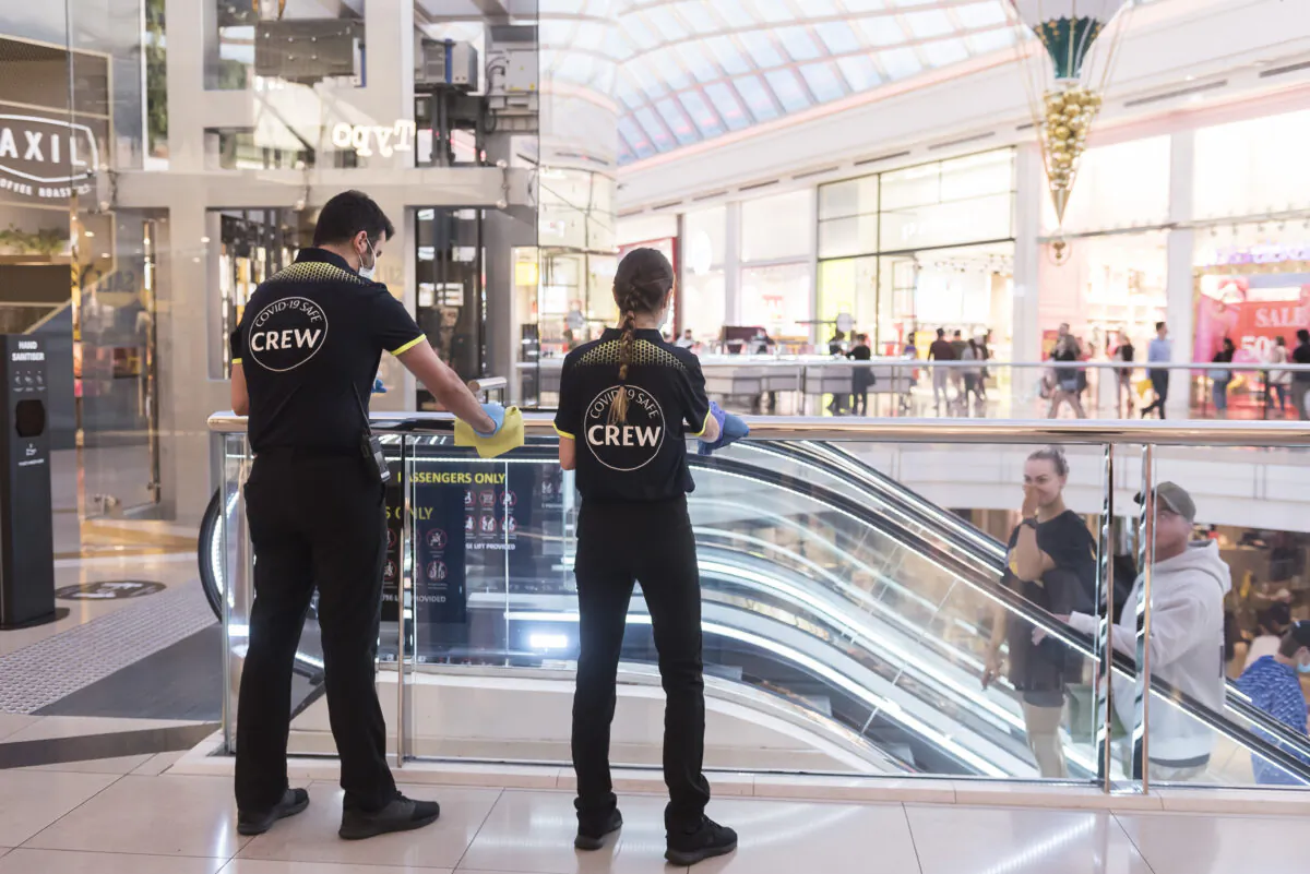 Employees maintain Covid-19 safety at Chadstone The Fashion Capital in Melbourne, Australia, on Dec. 26, 2020. (Naomi Rahim/Getty Images)