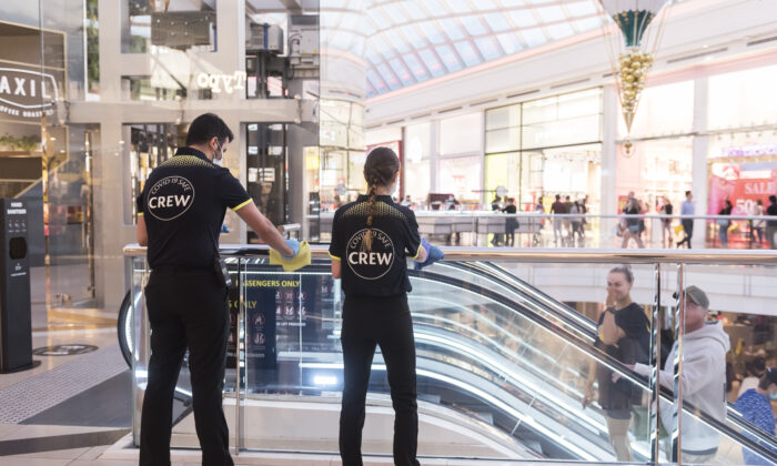Employees maintain Covid-19 safety at Chadstone The Fashion Capital in Melbourne, Australia, on Dec. 26, 2020. (Naomi Rahim/Getty Images)