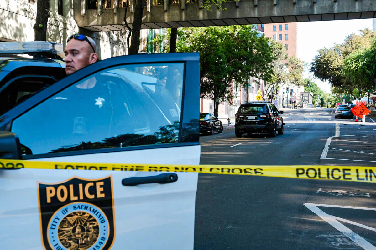 Police officers work the scene of a crime in Sacramento, Calif., on April 3, 2022. (David Odisho/Getty Images)