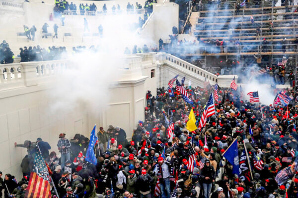 Police release tear gas into a crowd of demonstrators during clashes outside the U.S. Capitol in Washington on Jan. 6, 2021.