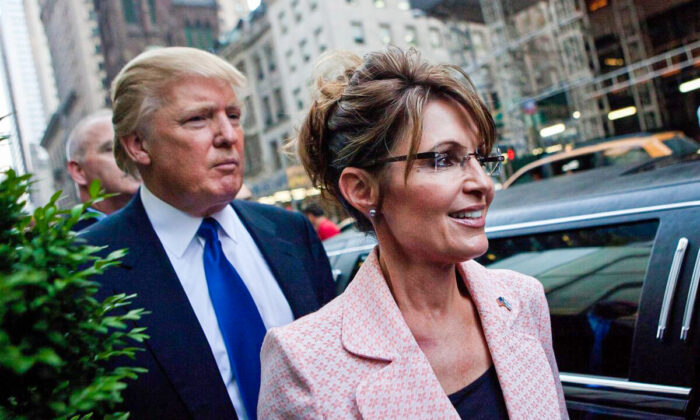 Former President Donald Trump, left, and former Alaska Gov. Sarah Palin walk in New York City in a file photograph. (Andrew Burton/Getty Images)