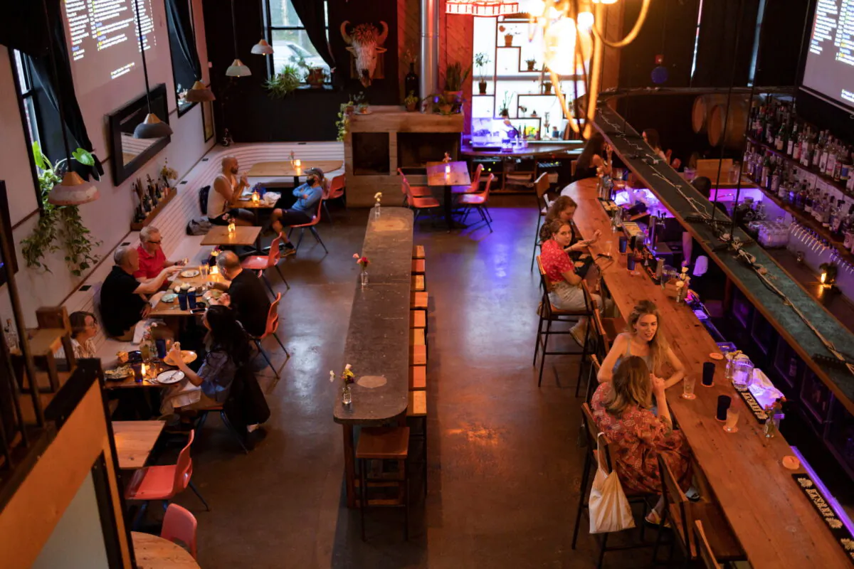 Customers drink and dine inside the restaurant "Martha" after showing proof of their COVID-19 vaccinations upon entering, in Philadelphia, on Aug. 7, 2021.  (Hannah Beier/Reuters)