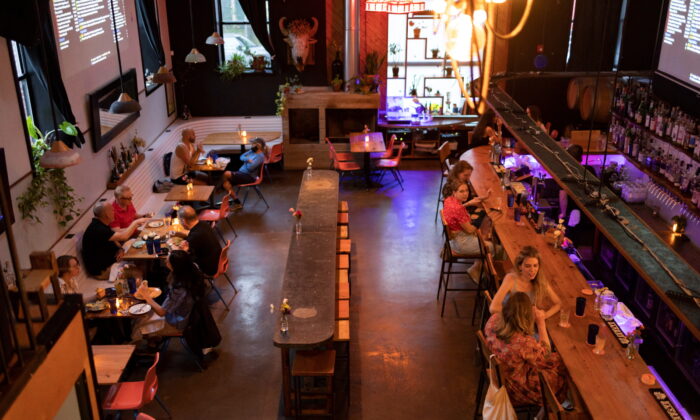 Customers drink and dine inside the restaurant "Martha" after showing proof of their COVID-19 vaccinations upon entering, in Philadelphia, on Aug. 7, 2021.  (Hannah Beier/Reuters)