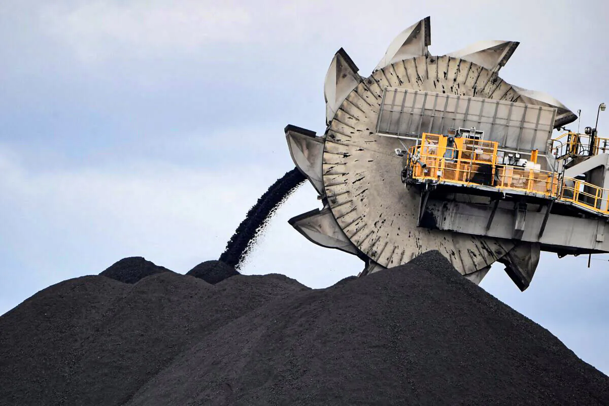 A bucket-wheel dumping soil and sand removed from another area of the mine in Newcastle, Australia, the world's largest coal exporting port, on Nov. 5, 2021. (Saeed Khan/AFP via Getty Images)