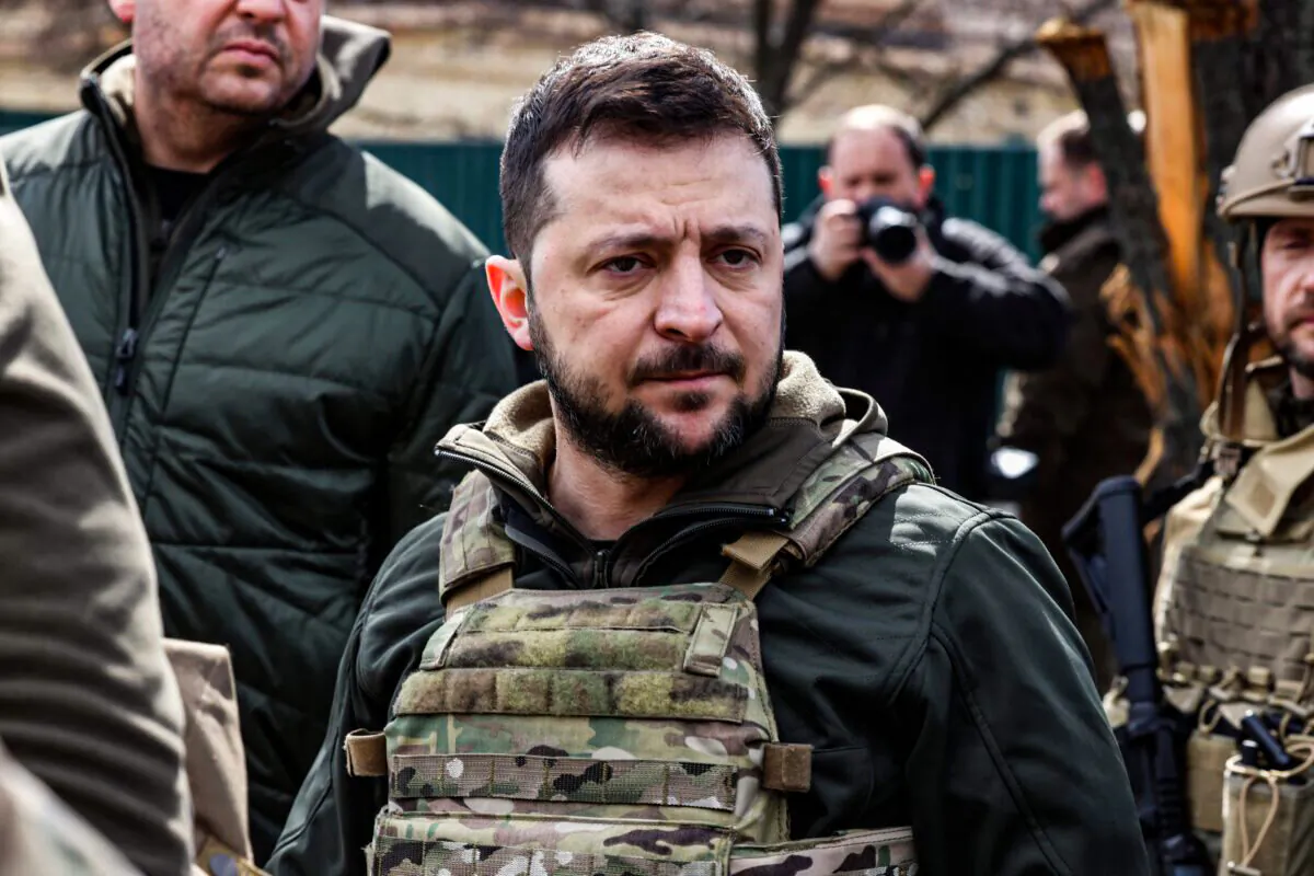 Ukainian President Volodymyr Zelenskyy stands in the town of Bucha, northwest of the Ukrainian capital Kyiv, on April 4, 2022. (Ronaldo Schemidt//AFP via Getty Images)