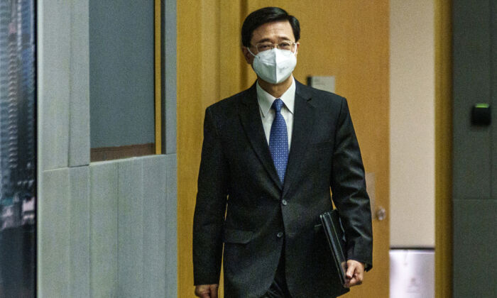 John Lee, Hong Kong's chief secretary, arrives at a press conference in Hong Kong on April 6, 2022. (Lam Yik - Pool/Getty Images)