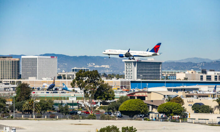 A plane flies in for landing at Los Angeles International Airport on Feb. 18, 2022. (John Fredricks/The Epoch Times)