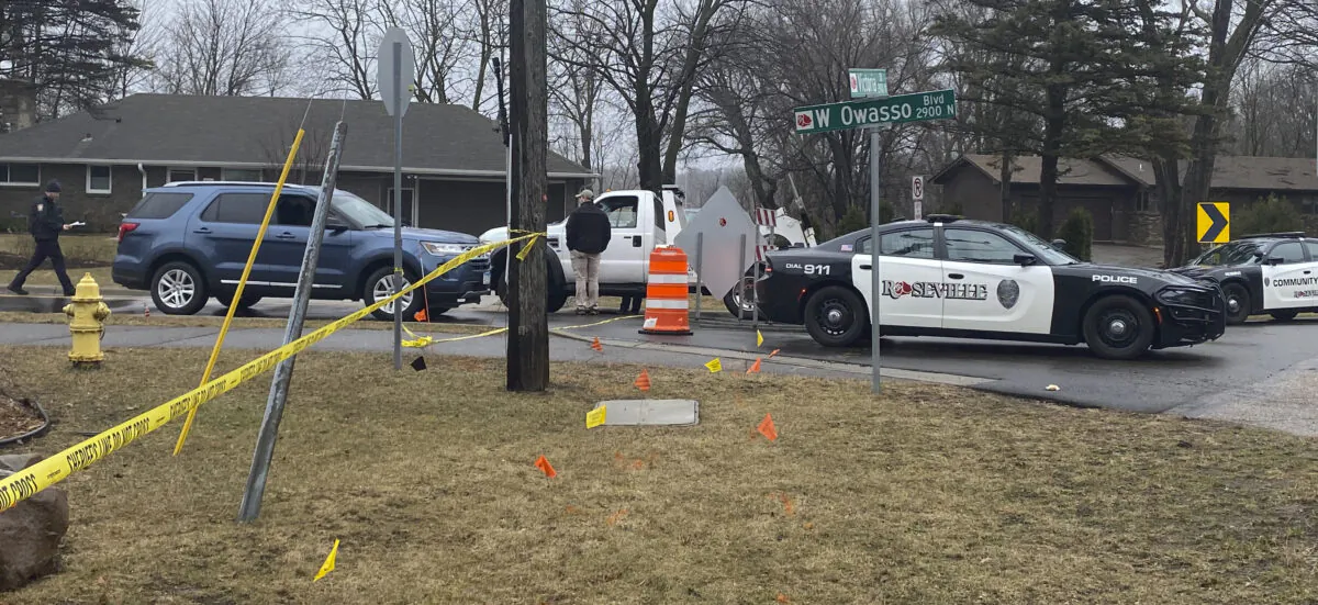 Authorities investigate the scene of a fatal April 5 shooting in Roseville, Minn., on April 6, 2022. (Nick Ferraro/Pioneer Press via AP)