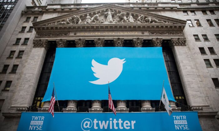 The Twitter logo is displayed on a banner outside the New York Stock Exchange, on Nov. 7, 2013. (Andrew Burton/Getty Images)