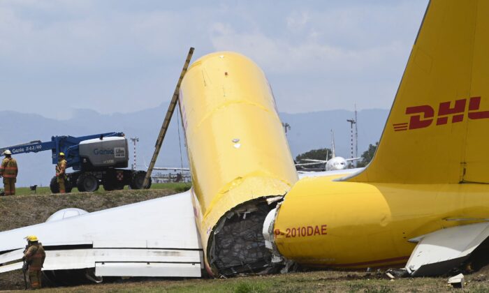 A cargo jet that spun off lays broken on the runway of the Juan Santamaria International Airport in Alajuela, Costa Rica, on April 7, 2022. (Carlos Gonzalez/AP Photo)