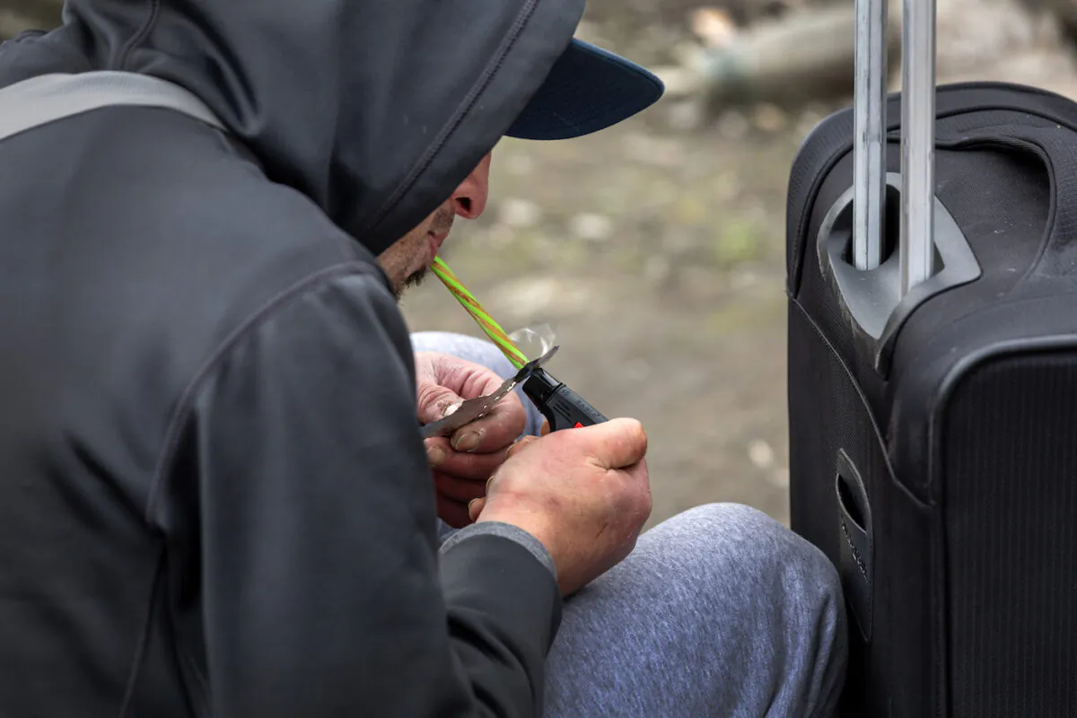 A homeless man, 24, smokes fentanyl in Seattle, Wash., on March 12, 2022. (John Moore/Getty Images)