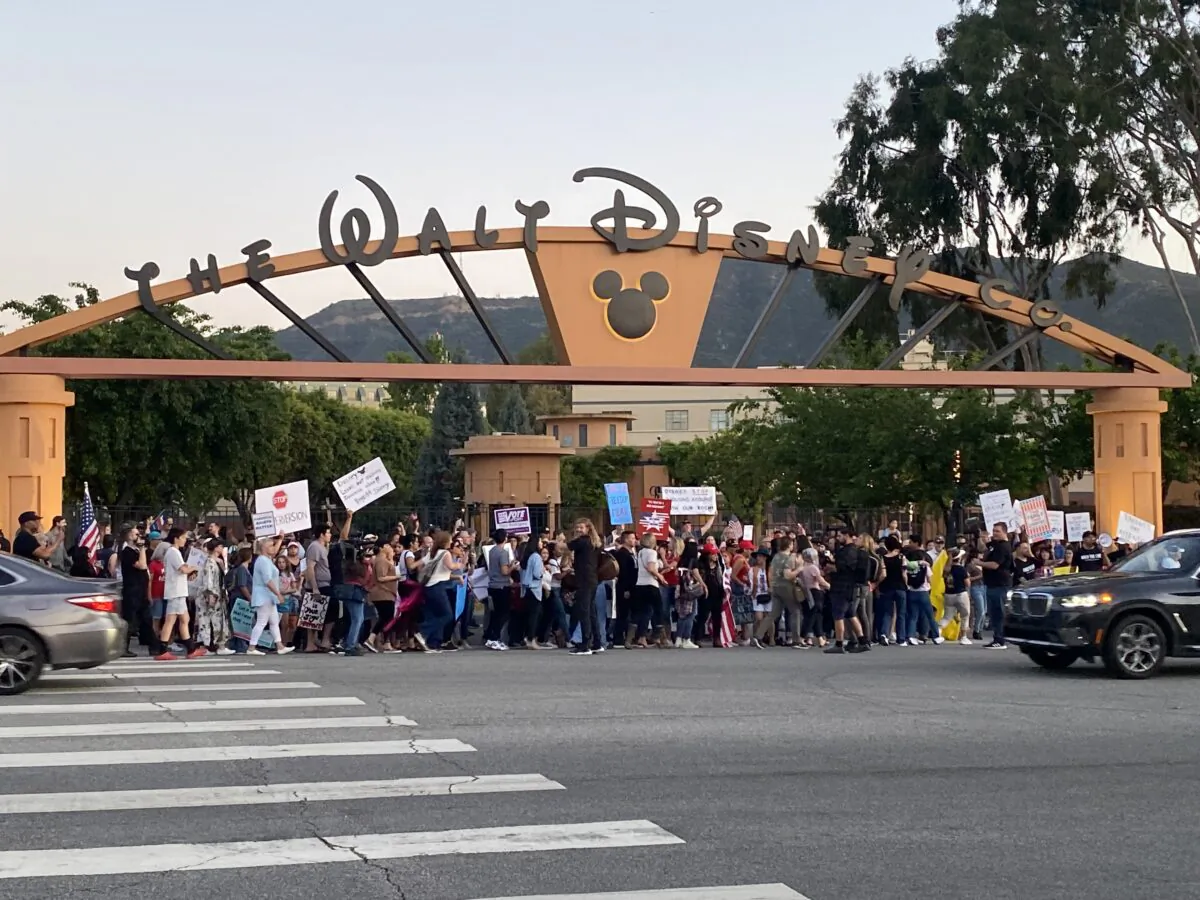 About 150 people attended the rally in opposition to the The Walt Disney Company's stance against a recently passed Florida law that prohibits schools from teaching their youngest students about sexual orientation and gender identity. The rally was in outside of Disney's headquarters in Burbank, Calif., on April 6, 2022. (Jill McLaughlin/The Epoch Times)