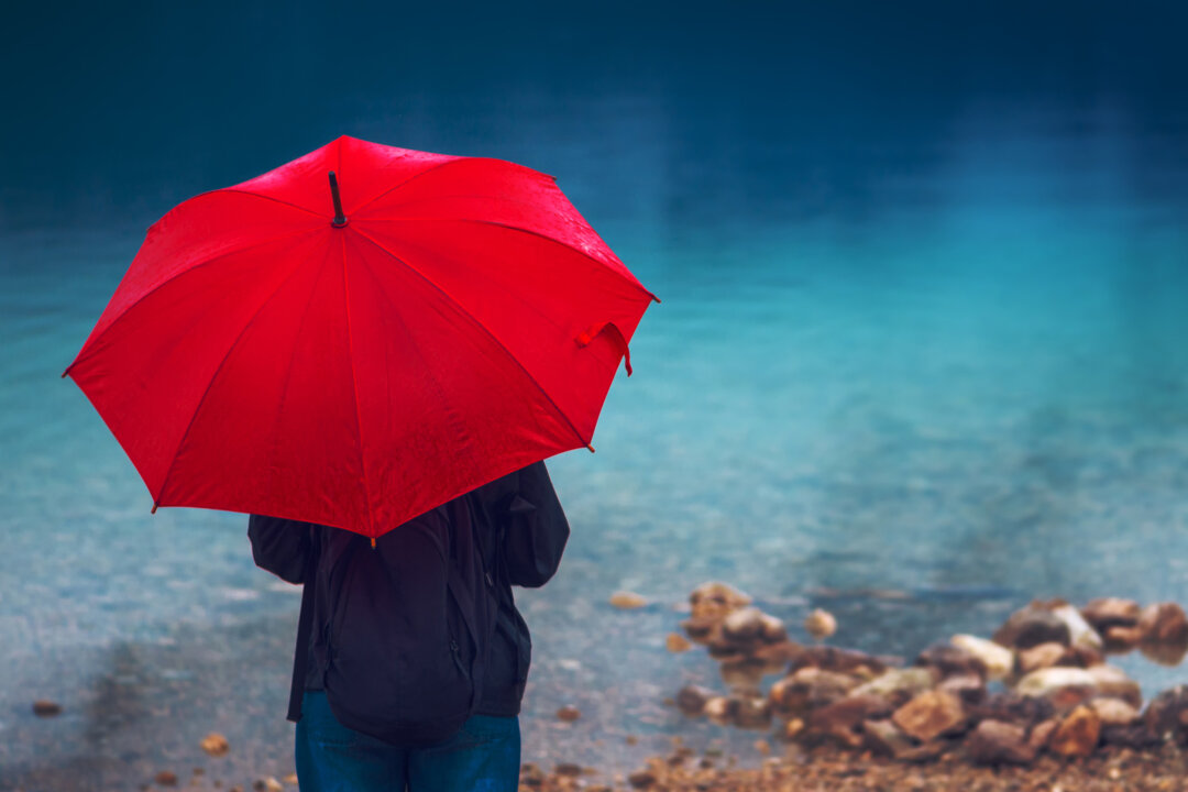 You may think you can name people who are so happy they’re floating in the clouds, but even they get stuck in the rain every now and then. (Dreamstime/TNS)