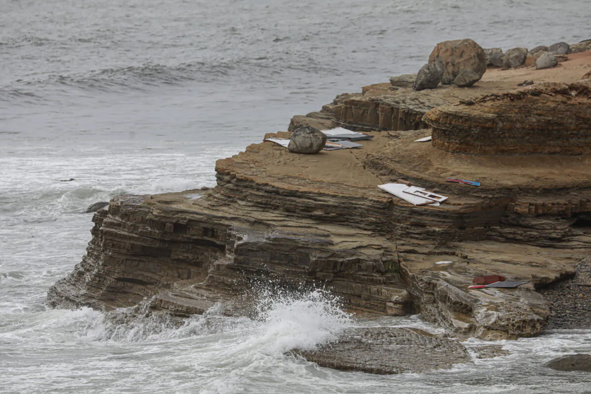 Debris along the shoreline off Cabrillo Monument in San Diego, on May 2, 2021. (Sandy Huffaker/Getty Images)