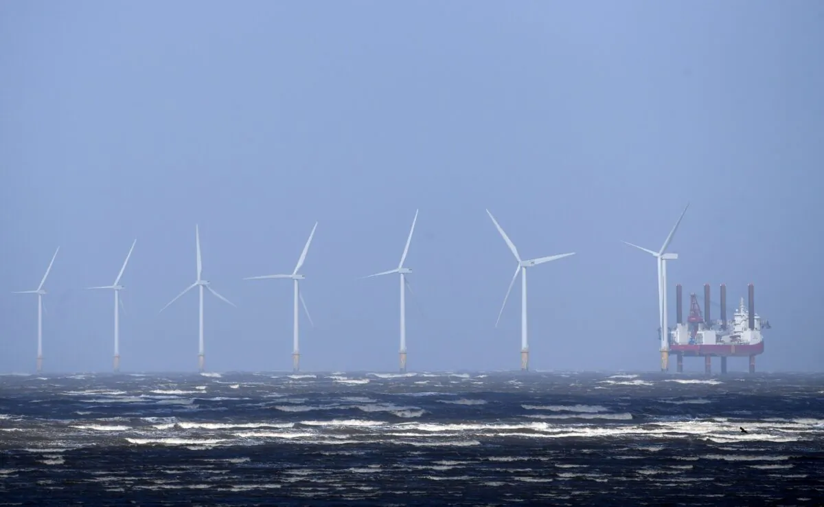 Waves break out at sea in front of Burbo Bank Offshore Wind Farm near New Brighton, at the mouth of the river Mersey in northwest England on March 13, 2019. (Paul Ellis/AFP via Getty Images)