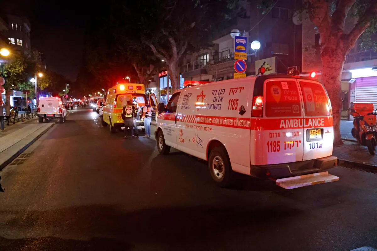 First responders arrive at the scene of a shooting attack at a cafe in Dizengoff Street in the centre of Israel's Mediterranean coastal city of Tel Aviv on April 7, 2022. (Jack Guez/AFP via Getty Images)