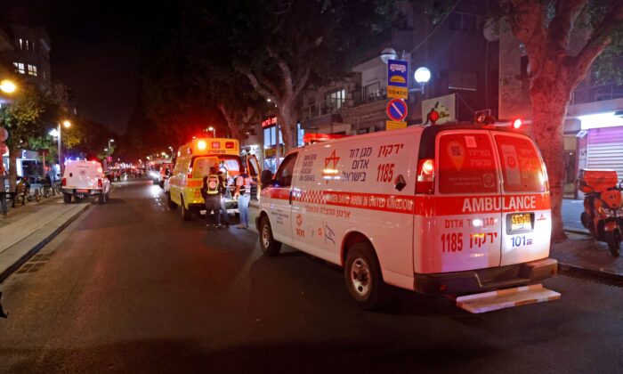 First responders arrive at the scene of a shooting attack at a cafe in Dizengoff Street in the centre of Israel's Mediterranean coastal city of Tel Aviv on April 7, 2022. (Jack Guez/AFP via Getty Images)