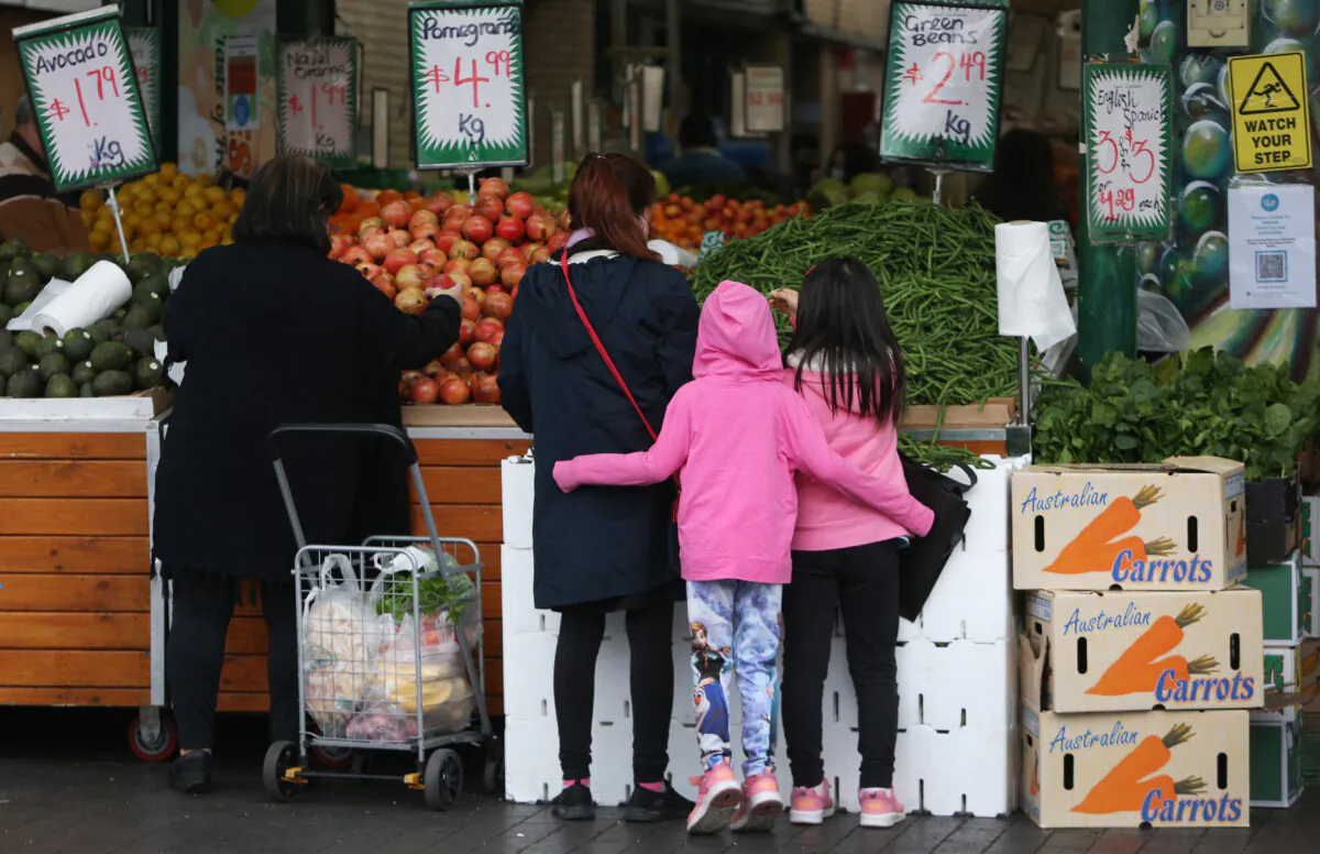 Shoppers gather to buy fruit and vegetables at a store in the suburb of Fairfield in Sydney, Australia, on July 9, 2021. (Lisa Maree Williams/Getty Images)